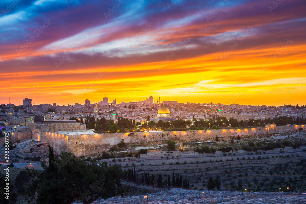 Dramatic sunset clouds over Jerusalem: panoramic view of the Old and New City skyline, of the Temple Mount with the Dome of the Rock, of the eastern wall with Golden Gate, and of Kidron Valley