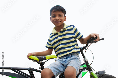 Portrait of confident boy With bicycle