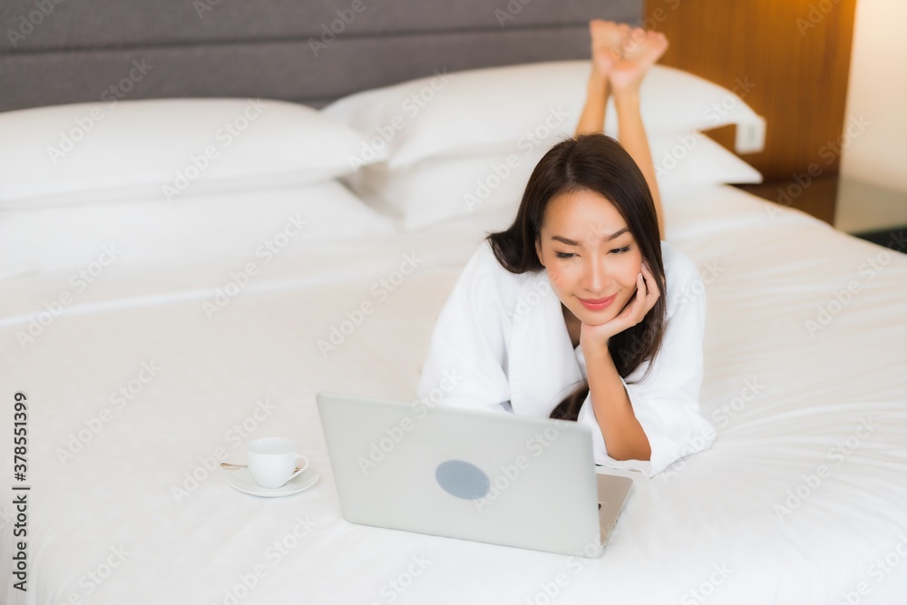 Portrait beautiful young asian woman use computer laptop on bed Portrait beautiful young asian woman use computer laptop on bed