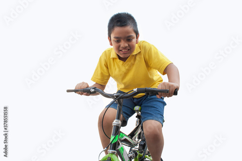 happy boy ride a bicycle 
