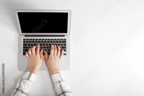 people sits on a work with a laptop computer for a table on the blackboard background