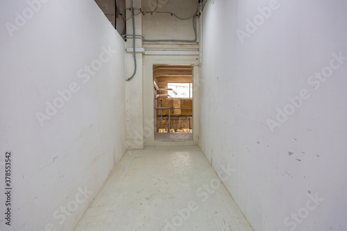 Long office corridor in modern industrial production area © ironstuffy