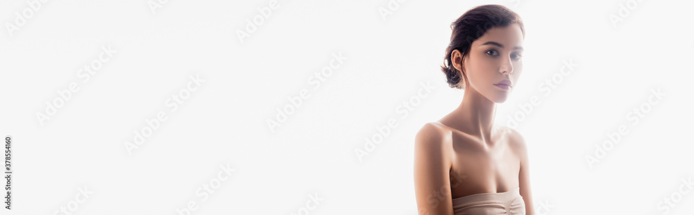 panoramic crop of brunette young woman looking at camera isolated on white panoramic crop of brunette young woman looking at camera isolated on white