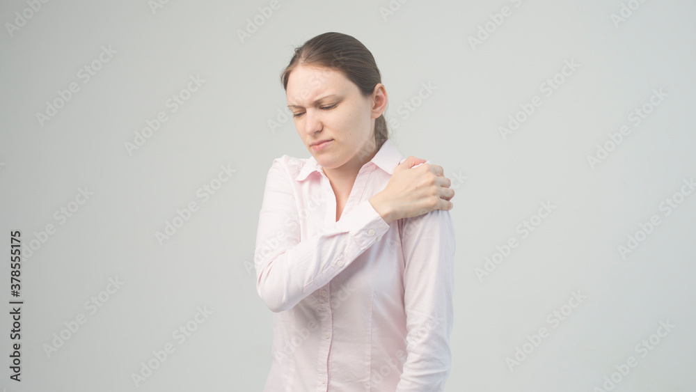 Tired woman feeling pain, massaging tense muscles Tired woman feeling pain, massaging tense muscles