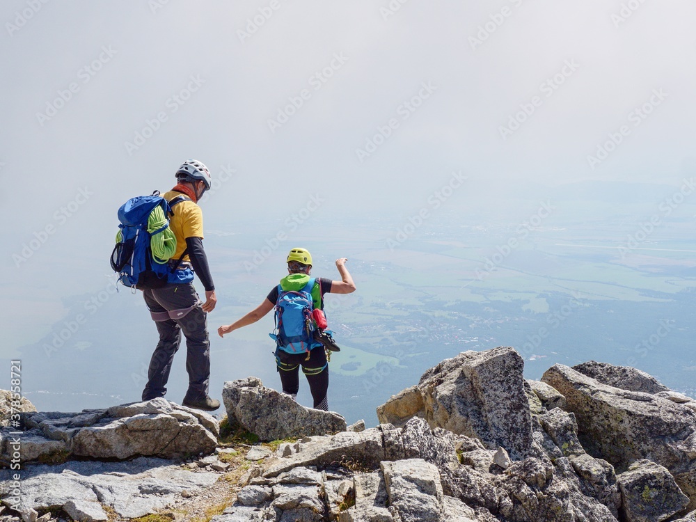 Alpine hikers descending into the valley