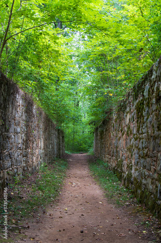 Walking trail between old stone walls at Landsford Canal State Park in South Carolina  USA