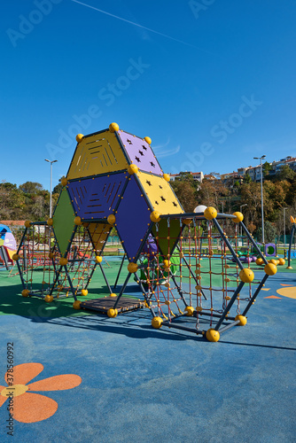 Wallpaper Mural Yellow and blue slides swing in the modern new style park. Torontodigital.ca