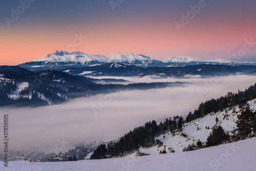 beautiful landscape with valleys, lakes and rivers in fog © Jaro