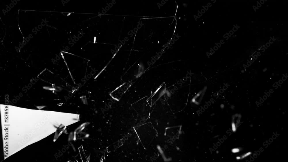 Super slow motion of shattered glass on black background. Filmed on high speed cinema camera, 1000 fps. Super slow motion of shattered glass on black background. Filmed on high speed cinema camera, 1000 fps.