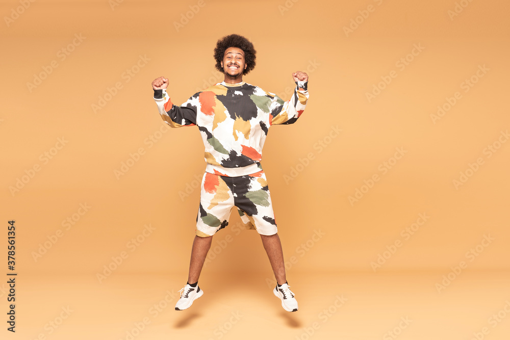 Fototapeta premium Young Afro Man Having Fun Jumping