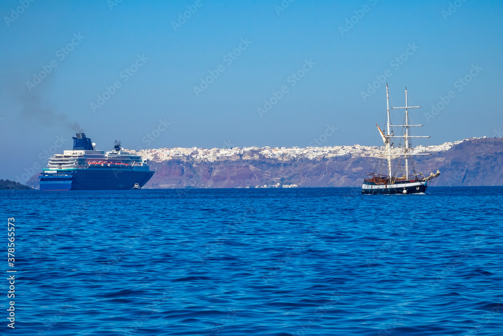 Old Sailing Ship and Modern Cruise Ship off the Coast of Santorini