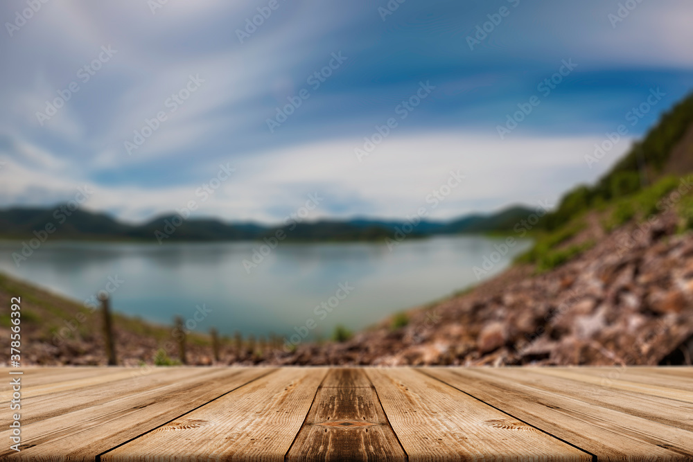Showcase an old wooden table shelf on a beautiful fall and blurred natural background.
