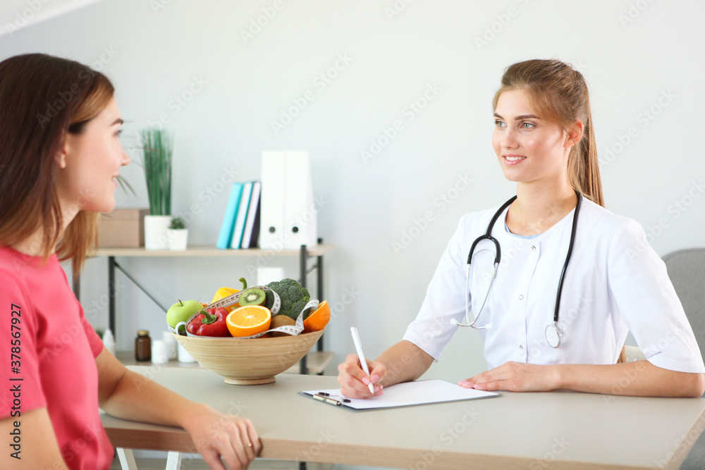 doctor nutritionist takes a patient in the office. proper nutrition, weight control