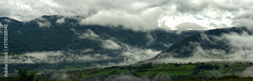 Italian landscape near Lago Di Garda typical with clouds in the morning mood extra wide panorama