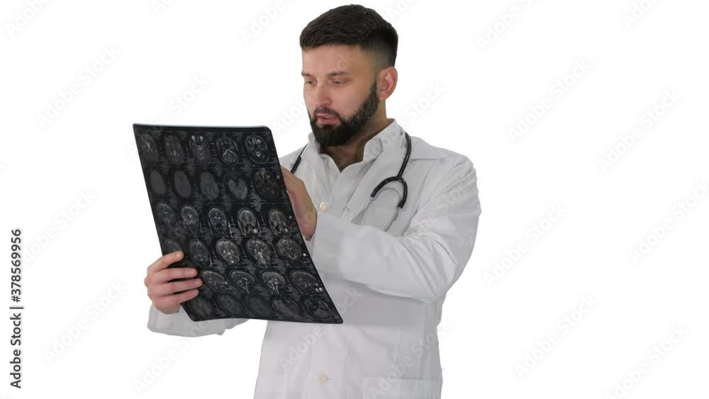 Confident doctor working with MRI scan results on white background.