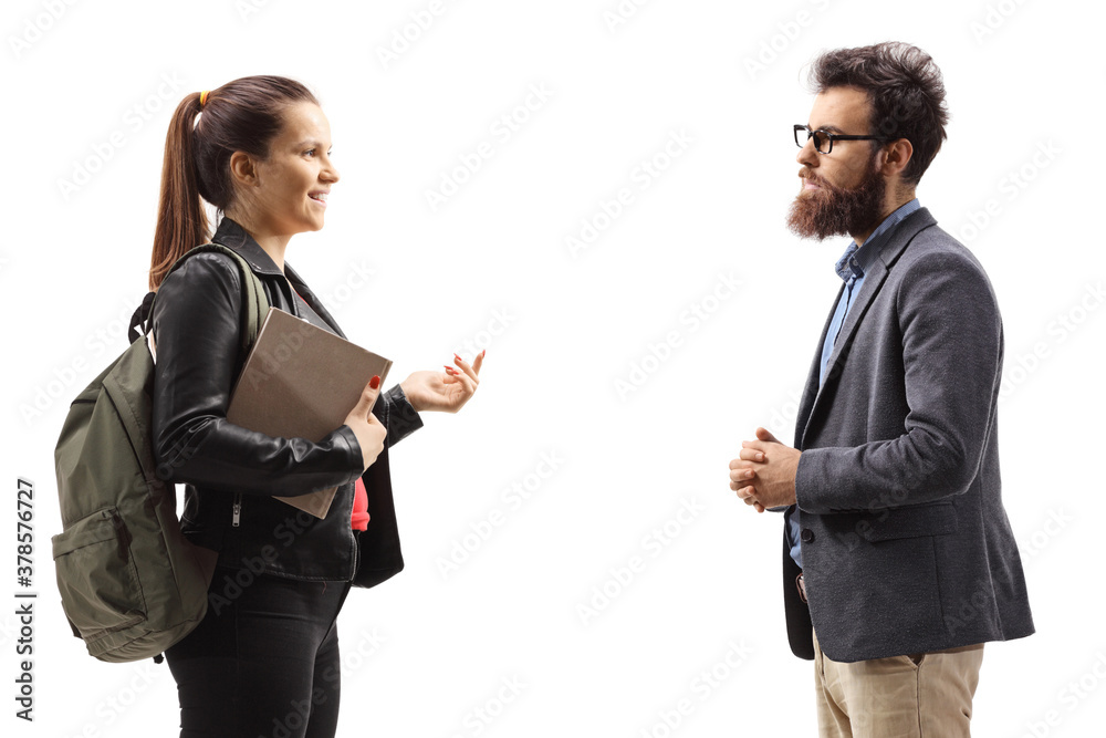 Student with a backpack and a book talking to a bearded man