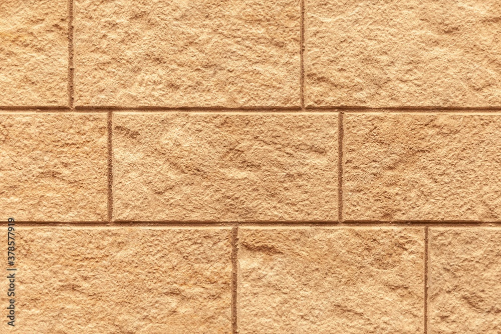 Block pattern of brown stone cladding wall tile texture and seamless