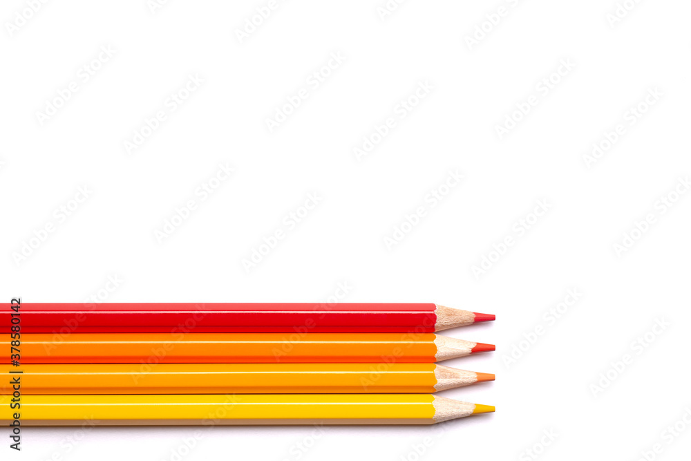 multi-colored wooden pencils in red shades on a white isolated background, autumn colors, mock up, horizontally. multi-colored wooden pencils in red shades on a white isolated background, autumn colors, mock up, horizontally.