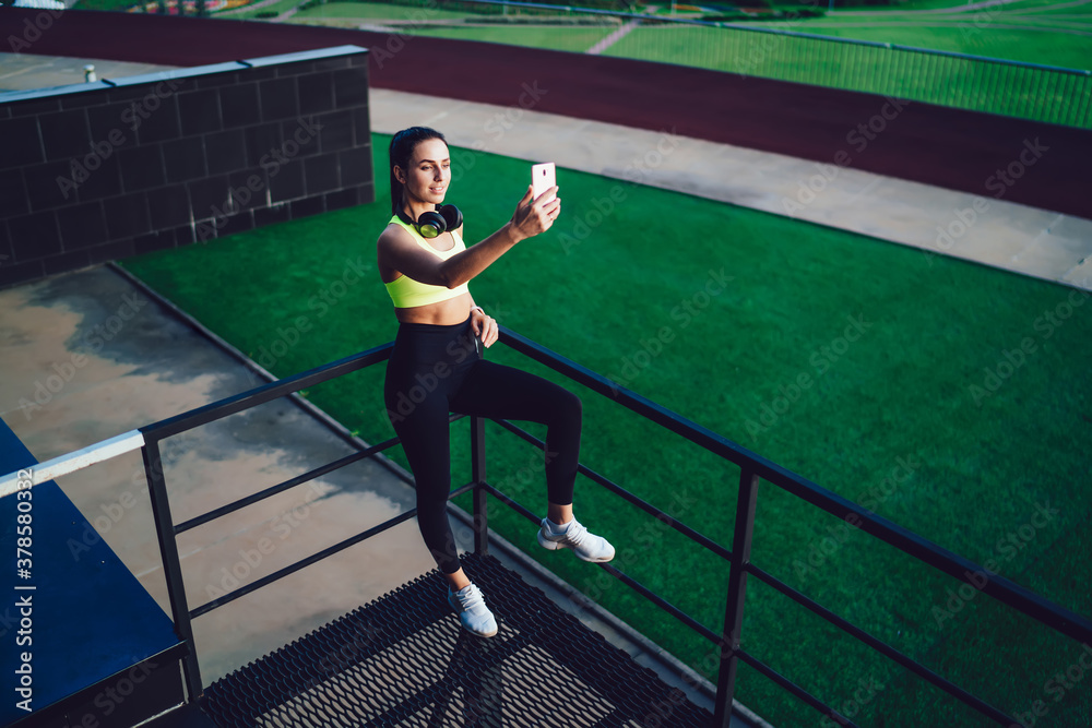 Female runner taking selfie on smartphone Female runner taking selfie on smartphone