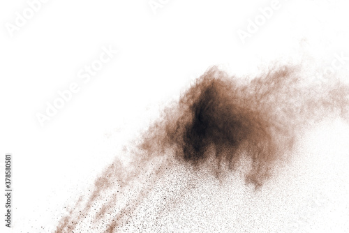 Brown powder explosion isolated on white background.