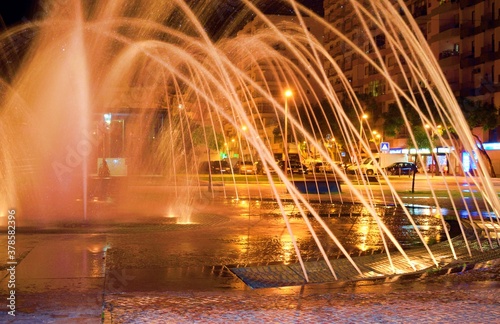 night landscape of the fountain in the central square of Portimao, Praca da Republica, Algarve, Portugal photo