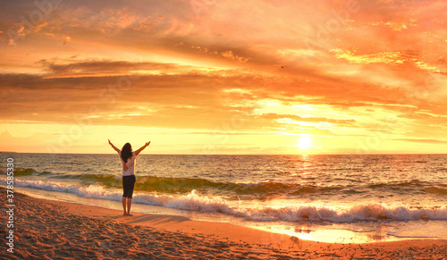 Joyful woman on the summer coast. photo