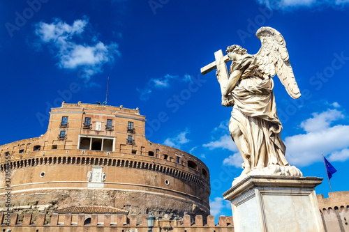 Castel Sant'Angelo and angel statue during sunny day in Rome, Italy © Nikolay N. Antonov