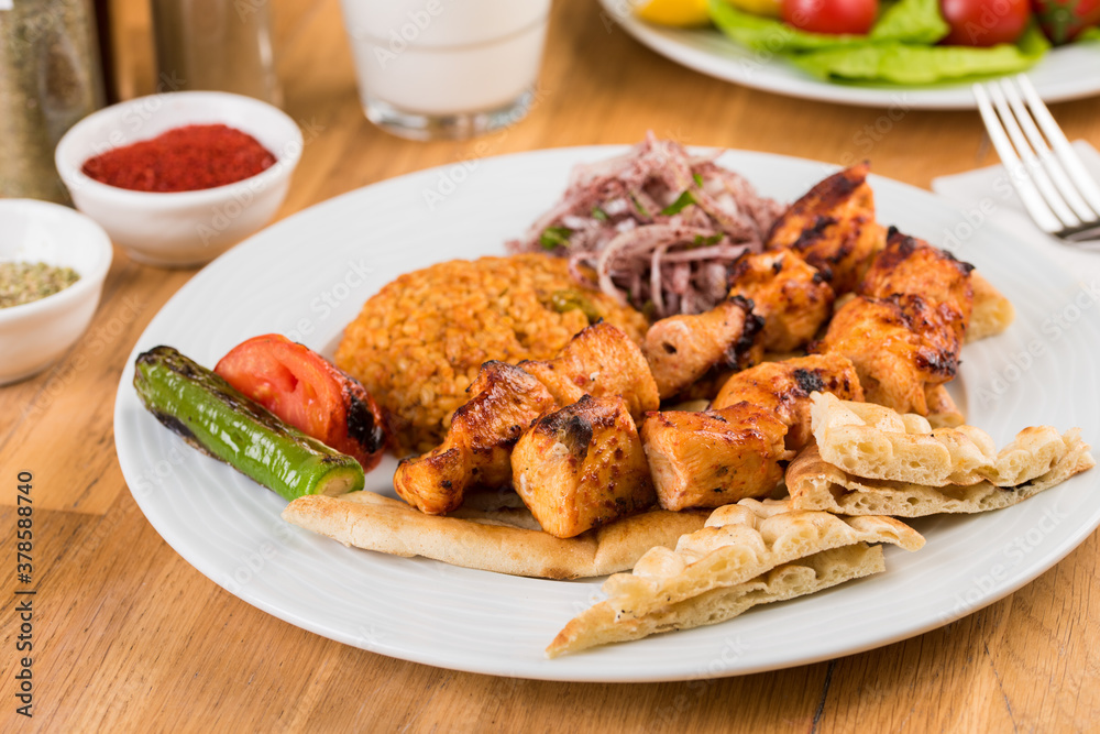 Traditional Turkish grilled Chicken shish kebab with vegetables grilled on skewers Traditional Turkish grilled Chicken shish kebab with vegetables grilled on skewers