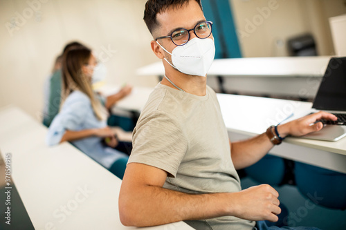 Male student wearing face p...