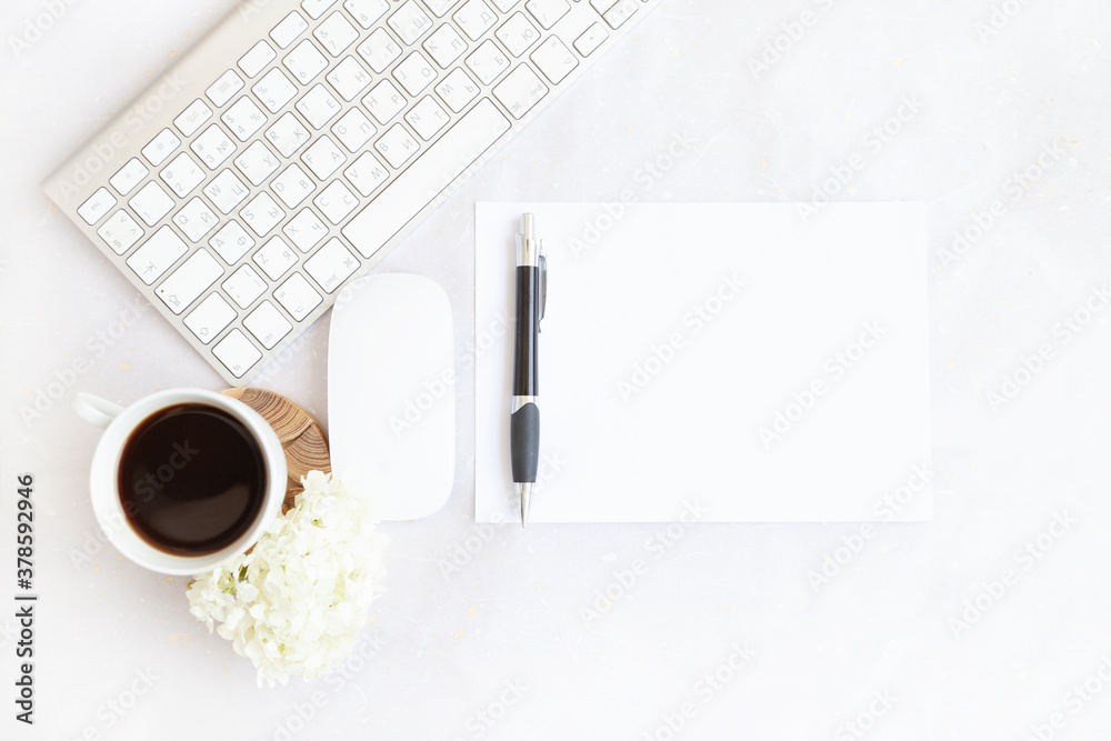 blue office desk background with smartphone with blank screen mockup, laptop computer, cup of coffee and supplies. Top view with copy space, flat lay.