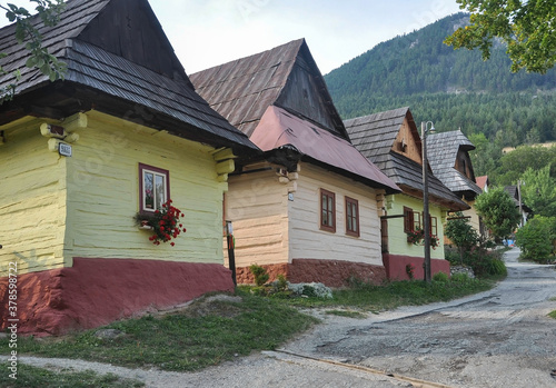 Obraz na płótnie VLKOLINEC, SLOVAKIA, EUROPE, SUMMER 2015. Beautiful street in the center of the Unesco Heritage village of Vlkolinec. The houses are made of wood and painted in neutral colors. w salonie