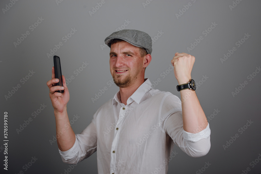 Naklejka premium Young successful businessman standing with hands up and celebrating success.