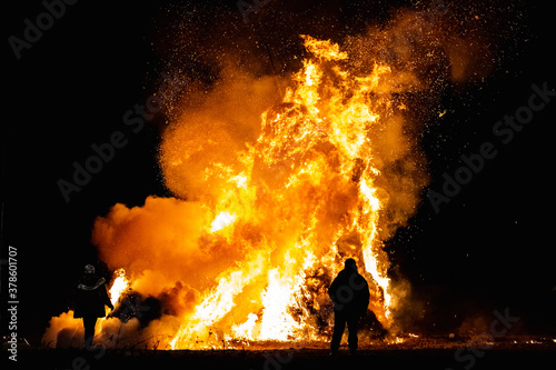 Ancient tradition of Epiphany fires in Friuli, Italy. Burning of a straw effigy. Farewell to winter, arrival of spring
