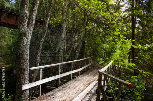 old wooden bridge over a small river