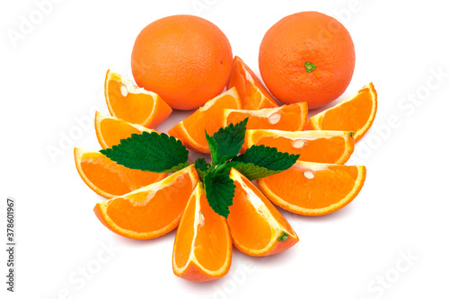 Orange with slices and green leaf of mint isolated on white background