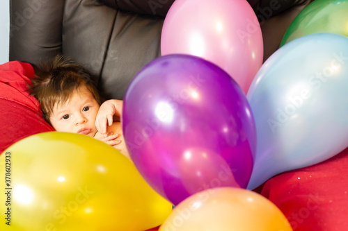 child with colorful balloons