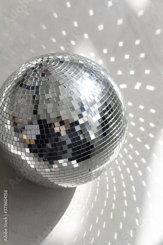 Silver disco ball in the morning sun