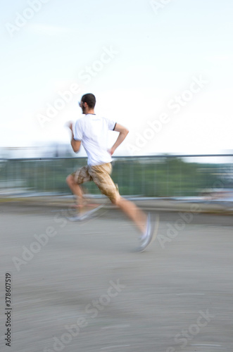 Motion. Blurred silhouette. Man on the move. The guy is blurred from fast movement. Run. Sport.