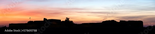 Fototapeta Naklejka Na Ścianę i Meble -  Silhouette of Ancient Bahrain Fort during sunset, Bahrain