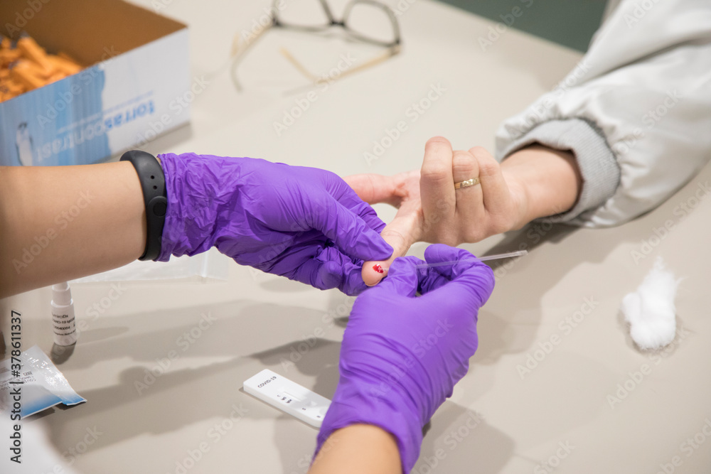 Nurse tests a person for Covid-19.
Nurse tests a person for Covid-19.