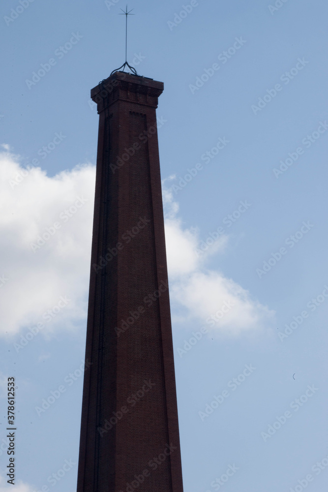 Brick smoke stack against the sky