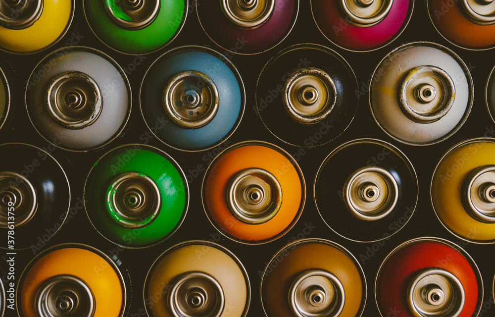 texture of multi-colored spray cans with paint for graffiti, for background and screen saver texture of multi-colored spray cans with paint for graffiti, for background and screen saver