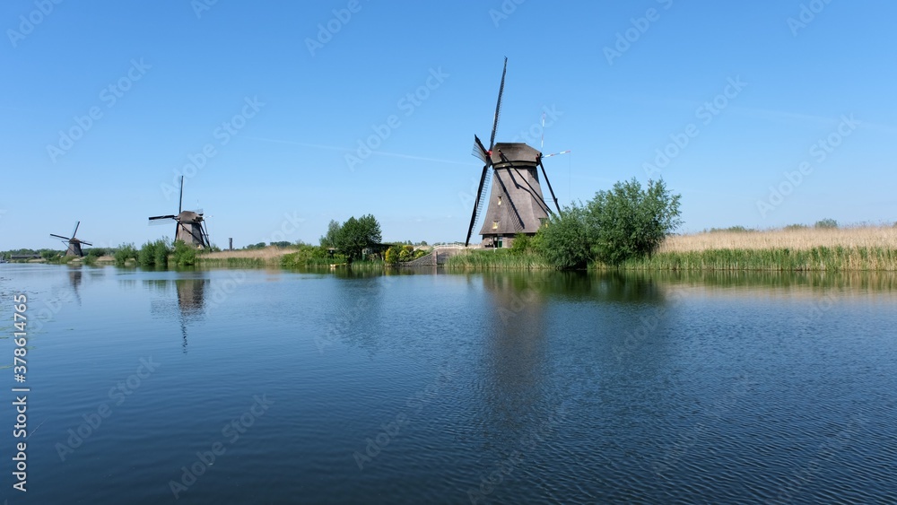 Windmills and water canal in Kinderdijk, Holland or Netherlands. Unesco world heritage site