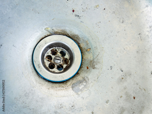 old dirty metal sink drain