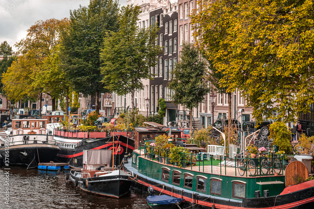 canal and boats in Amsterdam on an sunny autumn day