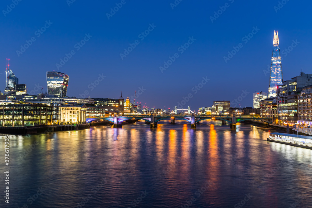 panorama of london over the thames at night