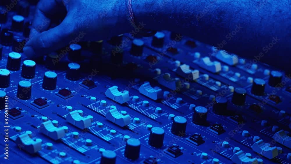 Music and sound studio. Male producer and dj. Close up of hands. Man