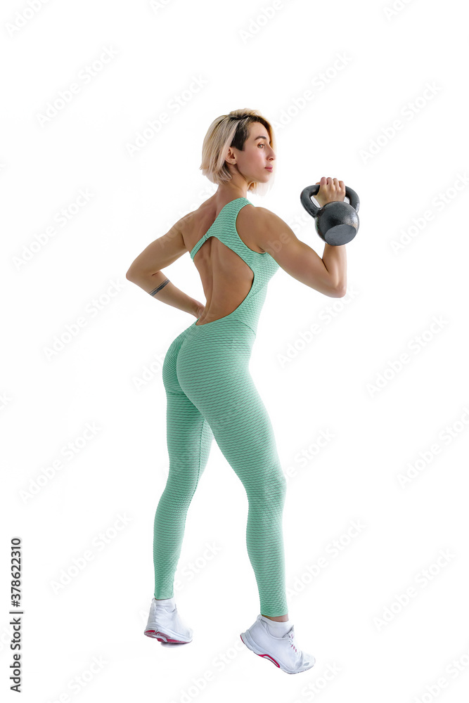 Fototapeta premium Fitness woman do kettlebell swing and kettlebell snatch. Crossfit training. Isolated on white background.