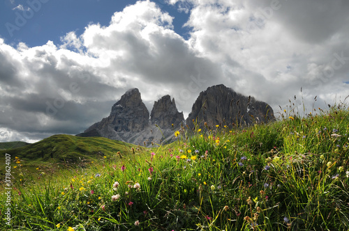 Sassolungo & Sassopiatto Dolomites Group as seen from Passo Sella on a cloudy afternoon in summer season. Dolomites, South Tyrol in Italy. photo