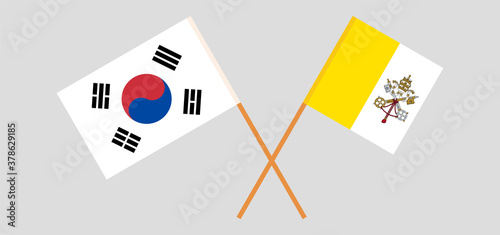 Crossed flags of Vatican and South Korea